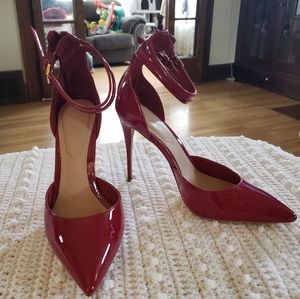 Red patent leather Aldo stilettos US size 8 w/ 2 strap detail and gold buckles.